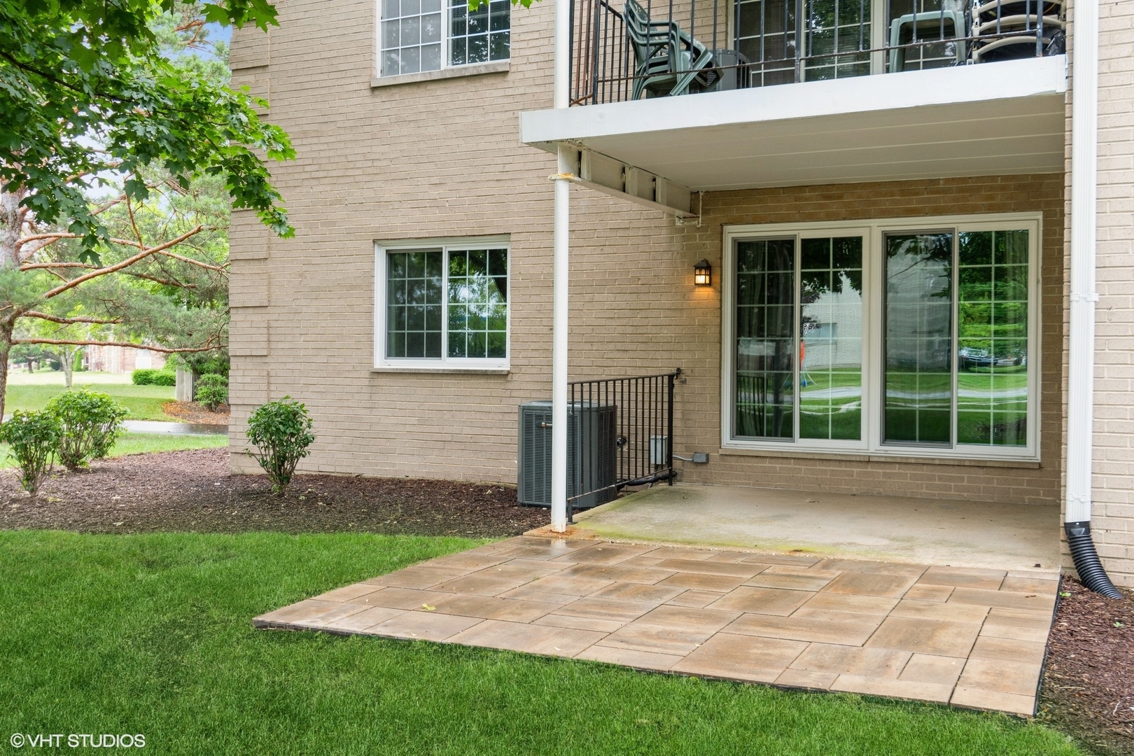 1258 Chalet Road, Unit 101 Naperville, IL 60563 - Photo 21 of 22 a view of a house with backyard and porch