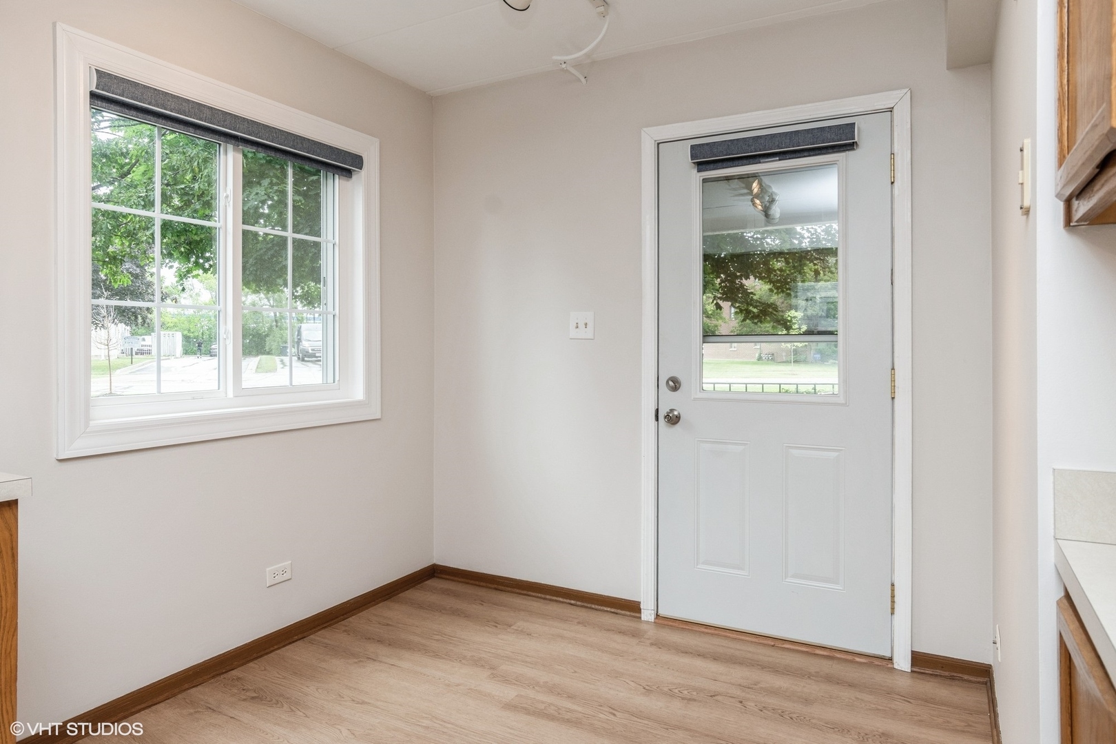 1258 Chalet Road, Unit 101 Naperville, IL 60563 - Photo 10 of 22 an empty room with wooden floor and windows