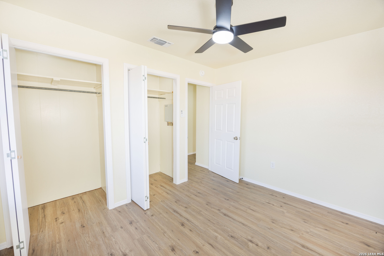 523 A Rossville Road Devine, TX 78016 - Photo 12 of 31 wooden floor in an empty room