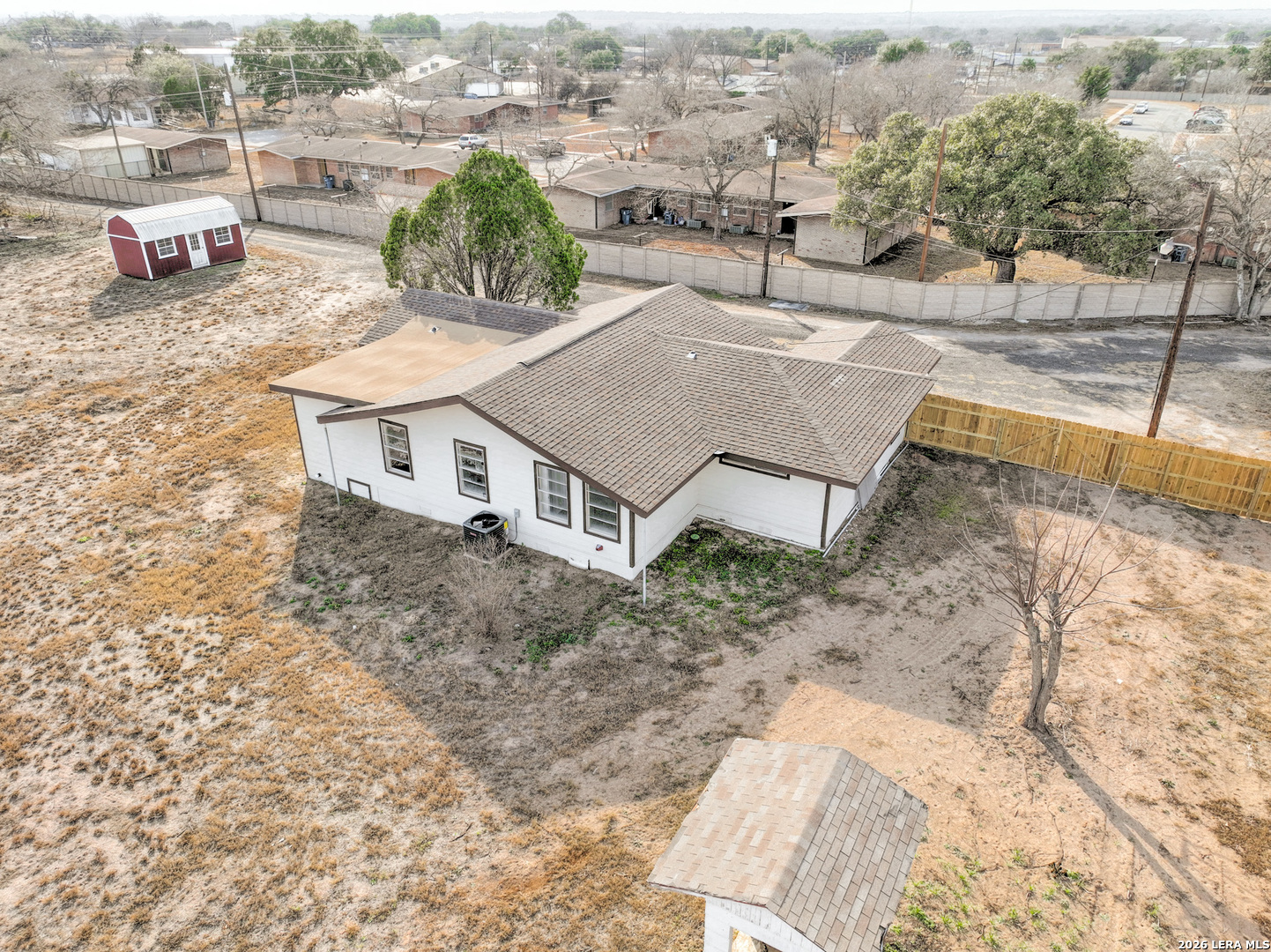 523 A Rossville Road Devine, TX 78016 - Photo 28 of 31 an aerial view of a house with a yard and sitting space