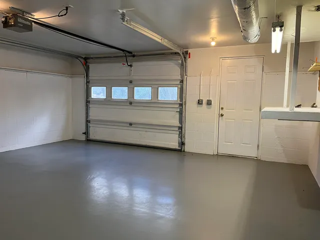 a view of a room with window and cabinet