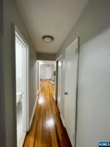a view of gallery with wooden floor