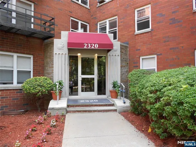 a view of a building with a potted plant