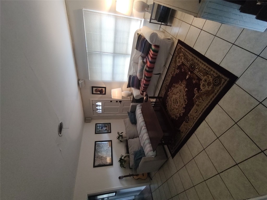 a living room with hard wood floor and furniture