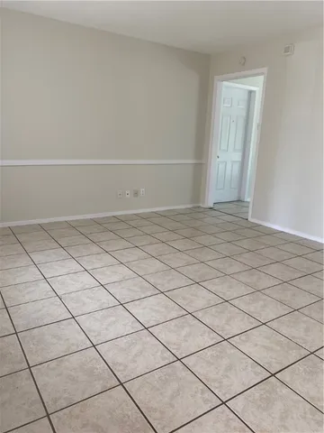 a view of an empty room and utility room