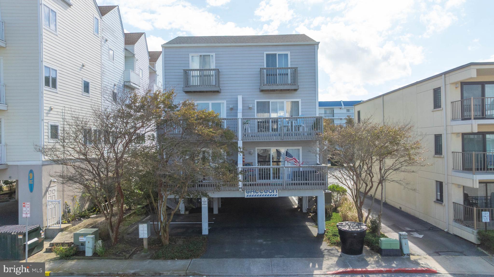11 144th Street, Unit 102 Ocean City, MD 21842 - Photo 18 of 27 a front view of a building with garden