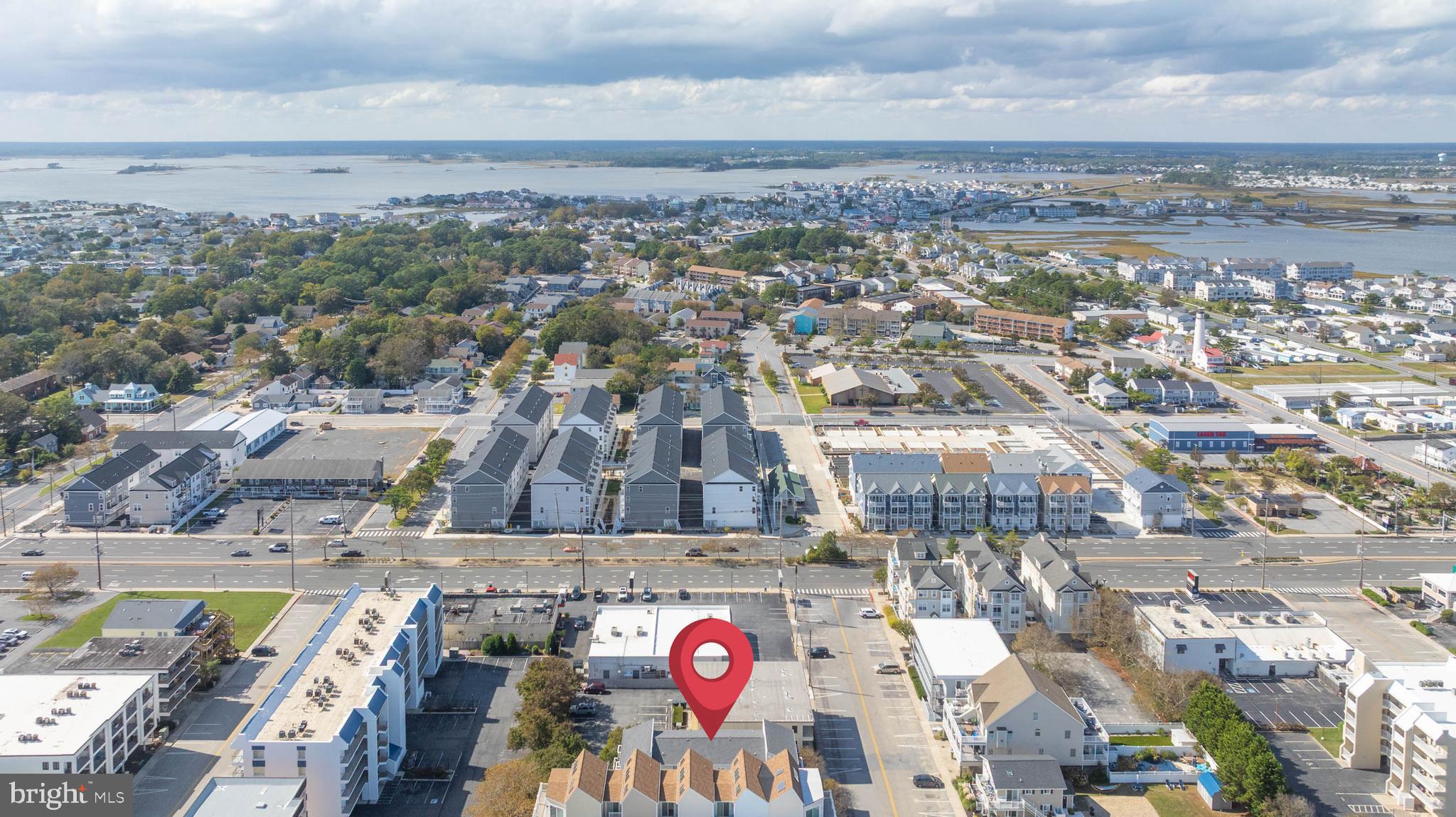 11 144th Street, Unit 102 Ocean City, MD 21842 - Photo 22 of 27 an aerial view of residential houses with outdoor space