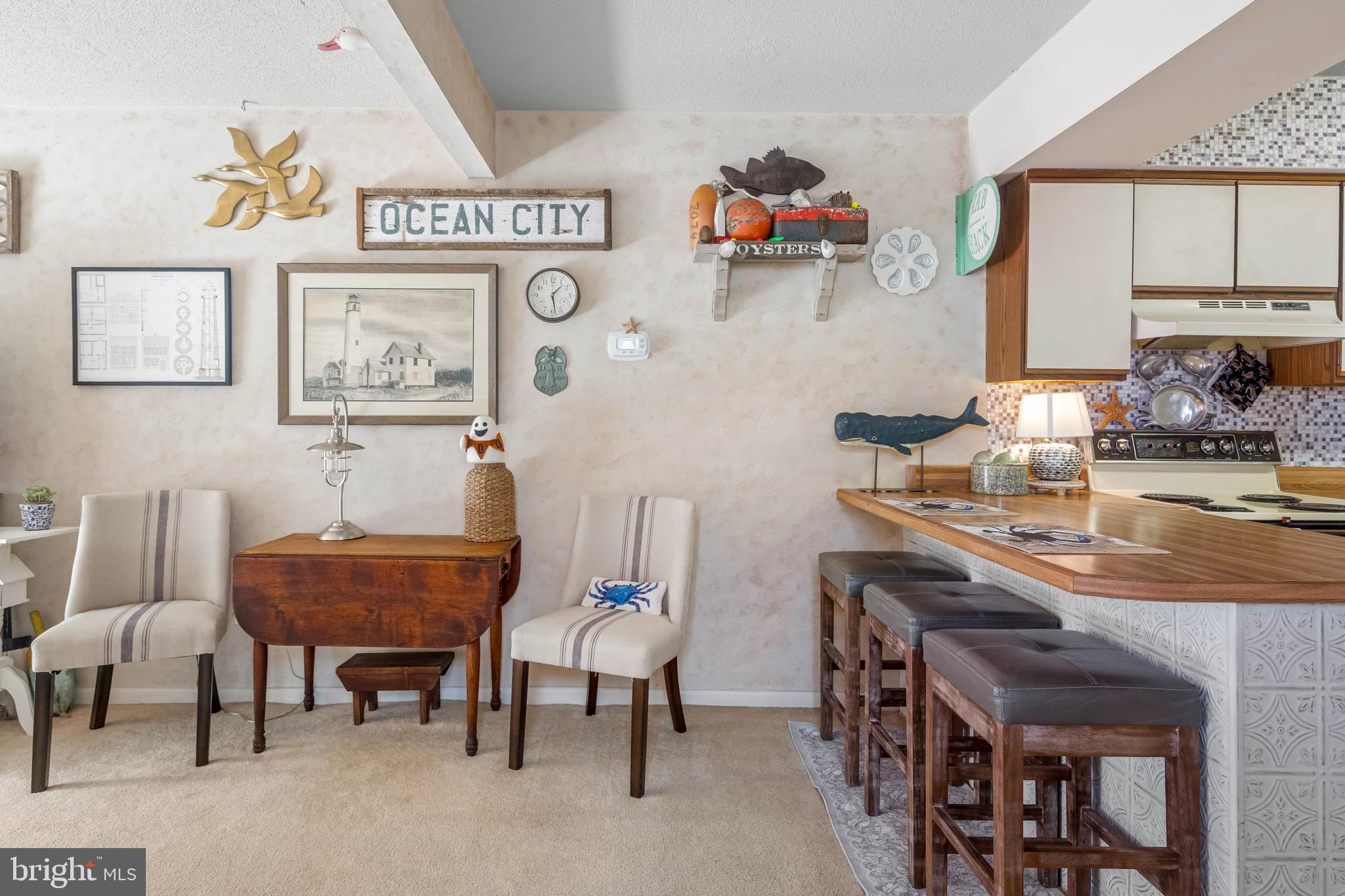11 144th Street, Unit 102 Ocean City, MD 21842 - Photo 10 of 27 a view of a dining room with furniture