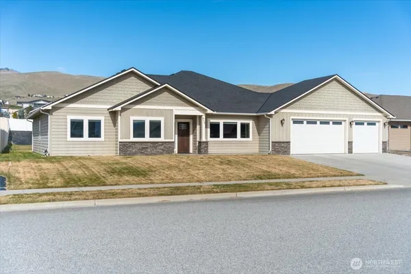 a front view of a house with a yard