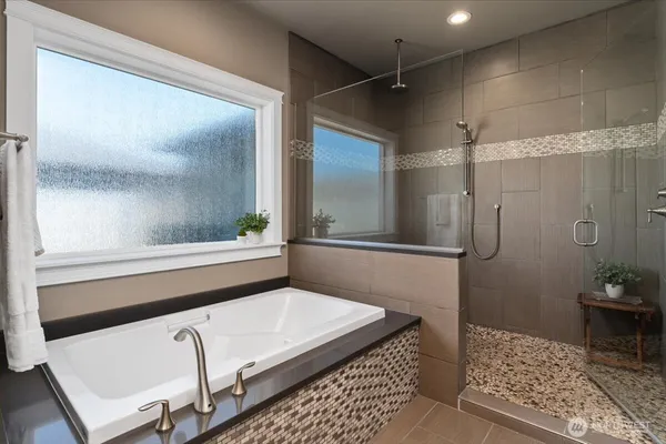 a bathroom with a shower and a mirror
