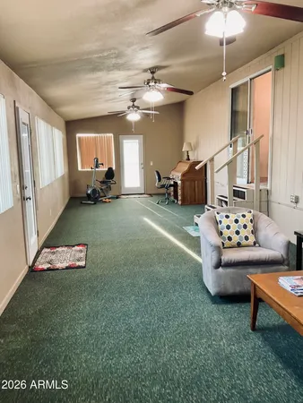 a living room with furniture and a window