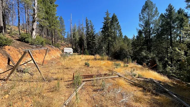 a view of snow on the side of a road