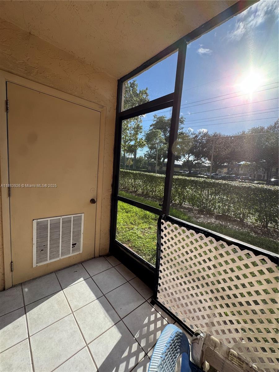142 Northwest 91st Avenue, Unit 104 Pembroke Pines, FL 33024 - Photo 11 of 15 a view of a bench in balcony
