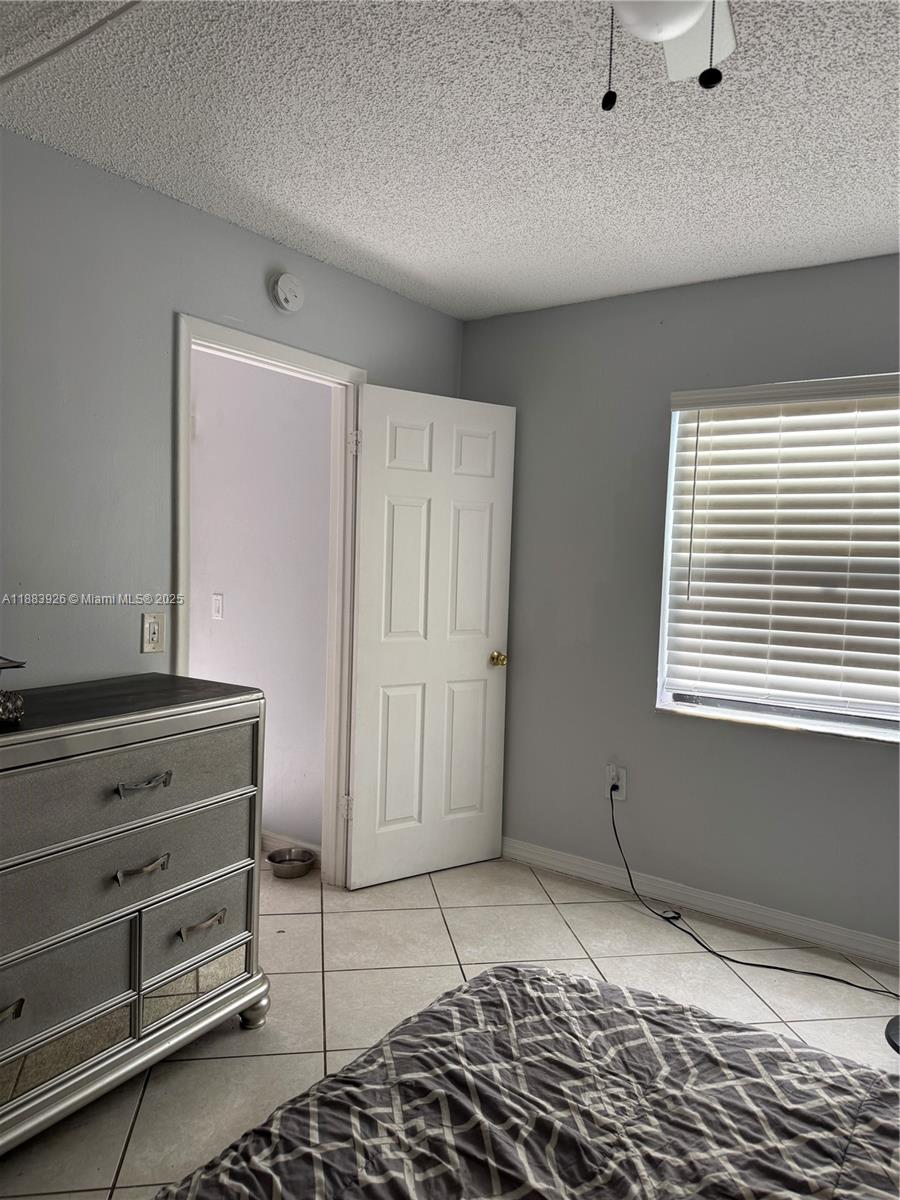 142 Northwest 91st Avenue, Unit 104 Pembroke Pines, FL 33024 - Photo 4 of 15 a view of room with window