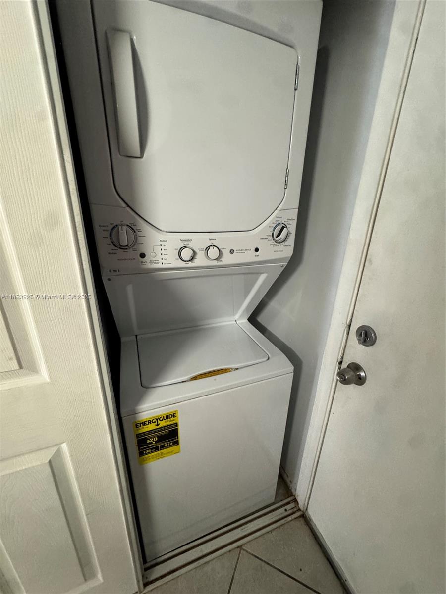 142 Northwest 91st Avenue, Unit 104 Pembroke Pines, FL 33024 - Photo 10 of 15 a utility room with dryer and washer