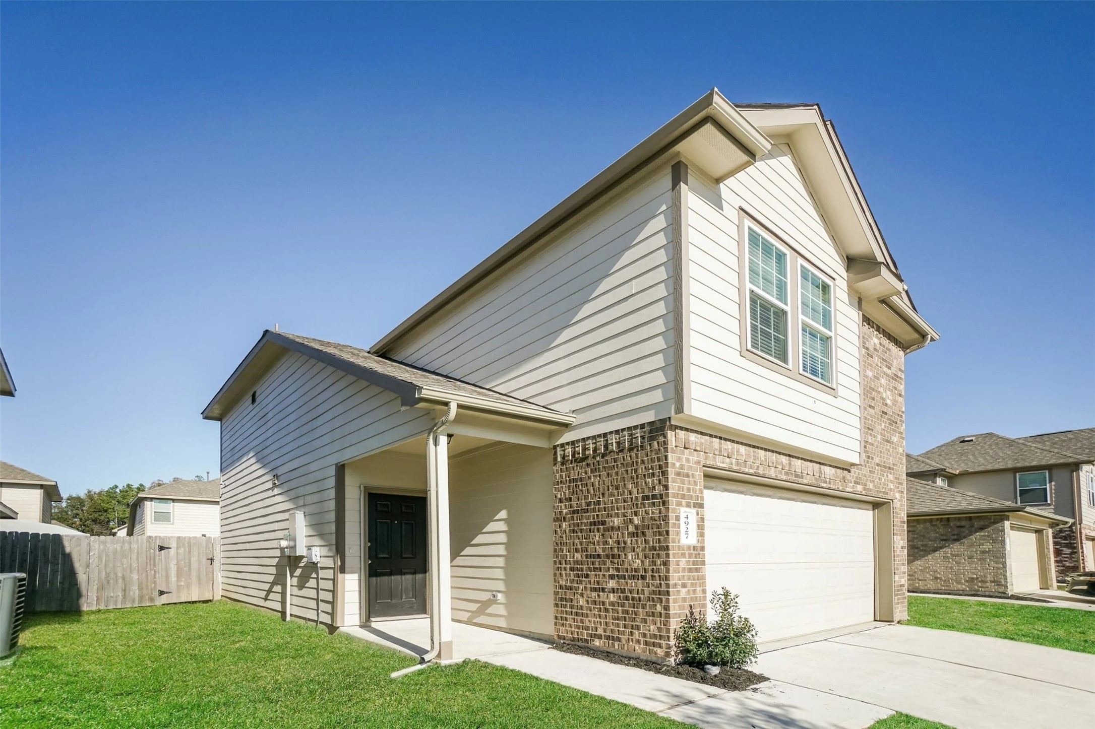 a view of house with yard
