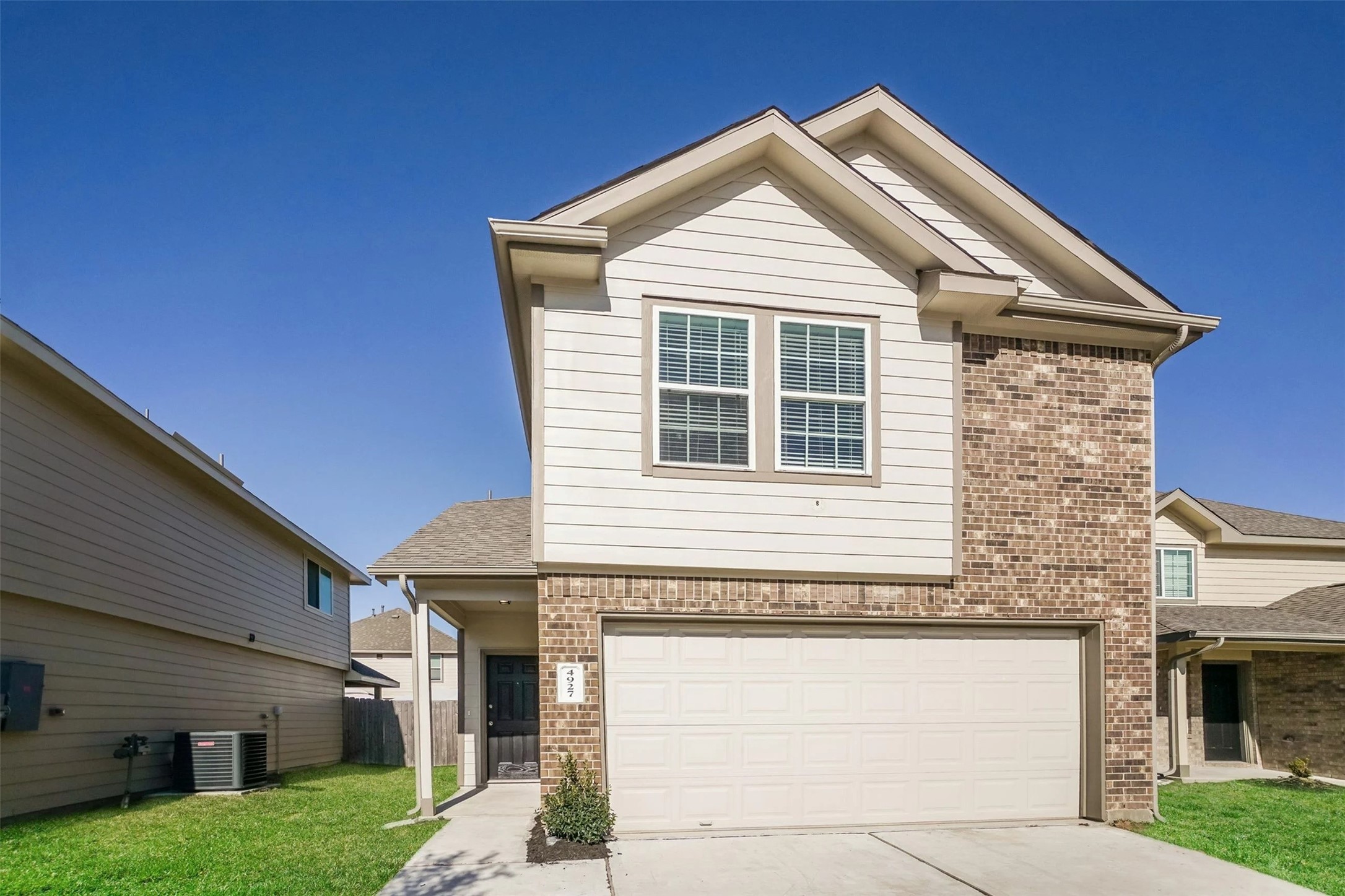 4927 Sweet Chestnut Lane Spring, TX 77373 - Photo 2 of 18 a front view of a house with a yard