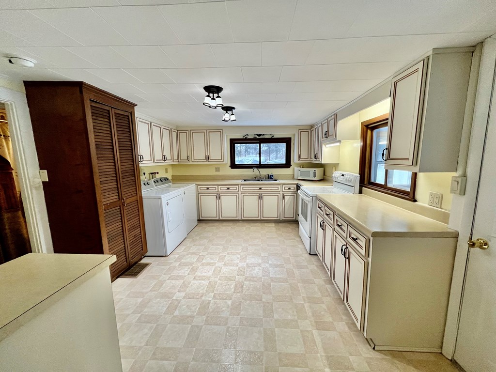 1747 Old Rte 322 Utica, PA 16362 - Photo 4 of 18 a kitchen with granite countertop a refrigerator stove top oven and sink