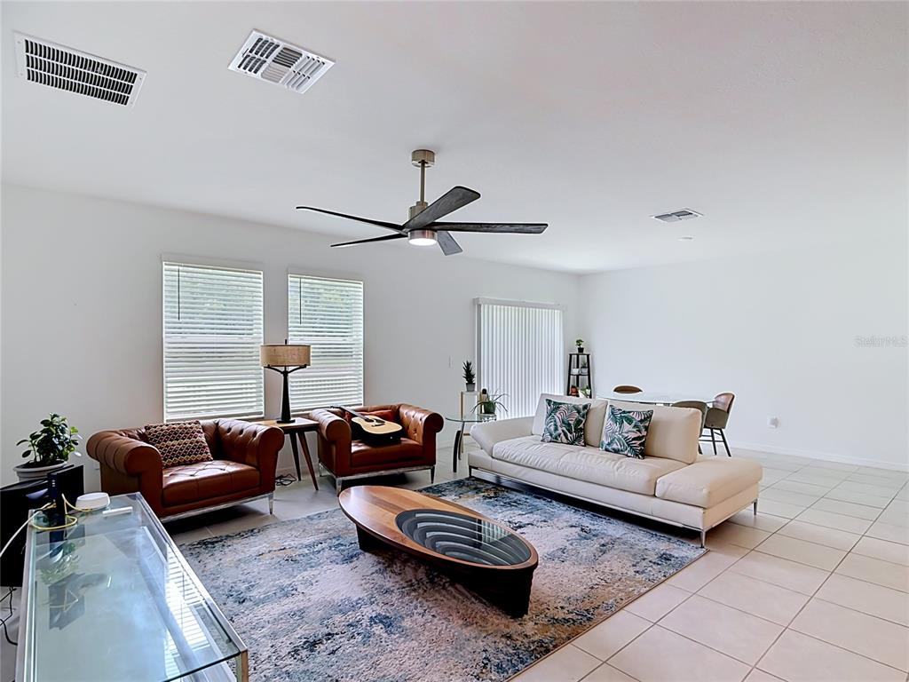 1633 Red Loop Lakeland, FL 33801 - Photo 14 of 60 a living room with furniture and a window