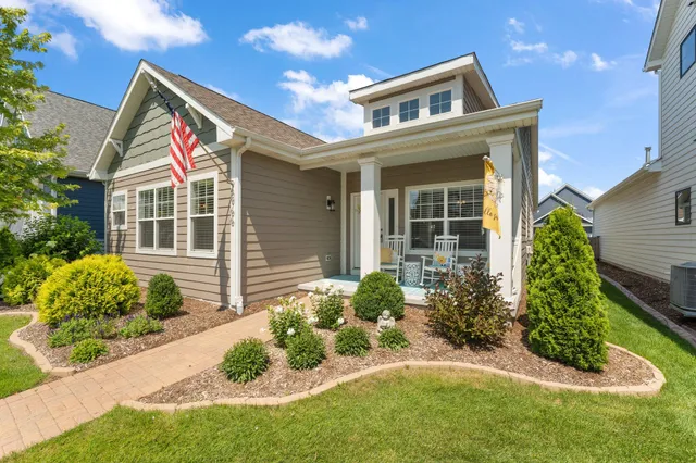 a front view of a house with garden