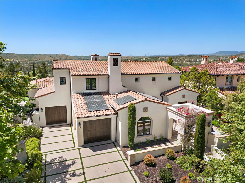 an aerial view of a house with a garden