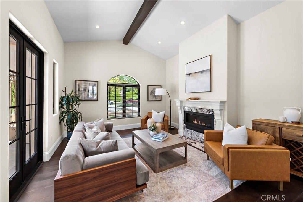 19 Alexa Lane Ladera Ranch, CA 92694 - Photo 12 of 63 a living room with furniture fireplace and a large window