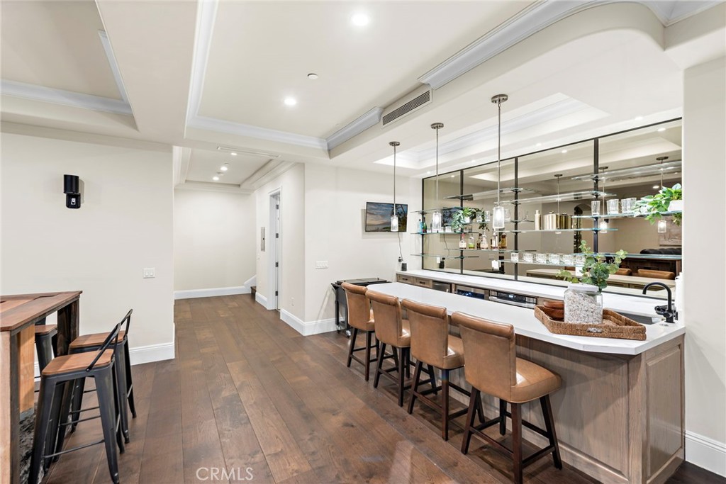 19 Alexa Lane Ladera Ranch, CA 92694 - Photo 45 of 63 a kitchen with stainless steel appliances a dining table chairs and wooden floor