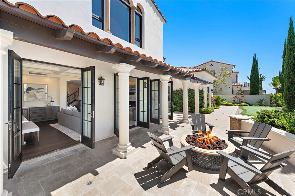 19 Alexa Lane Ladera Ranch, CA 92694 - Photo 5 of 63 a view of a patio with couches table and chairs and potted plants