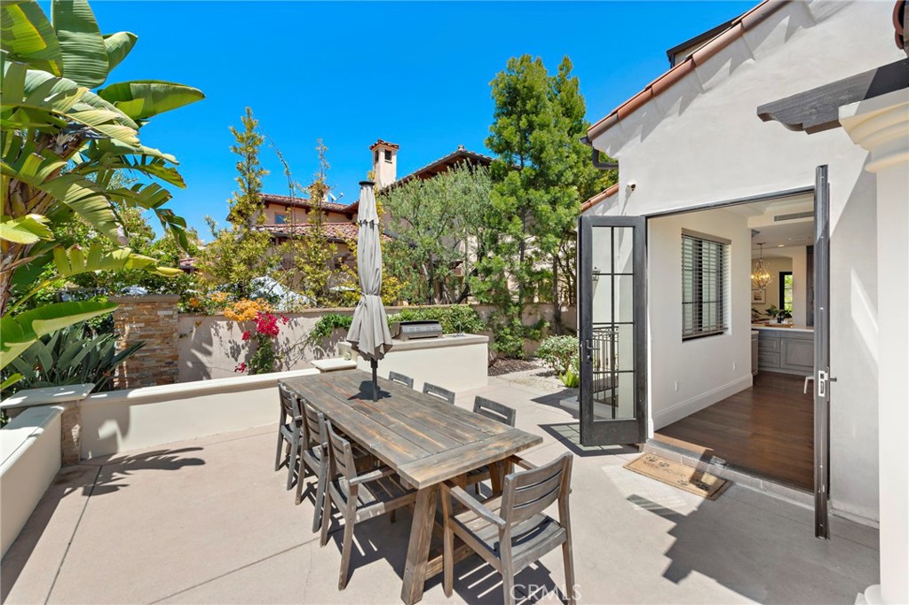 19 Alexa Lane Ladera Ranch, CA 92694 - Photo 51 of 63 a view of a patio with table and chairs and potted plants