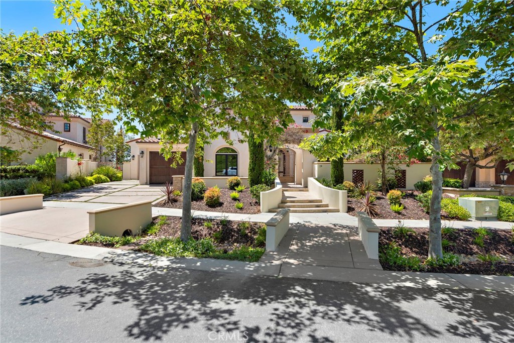 19 Alexa Lane Ladera Ranch, CA 92694 - Photo 55 of 63 a view of a patio with table and chairs potted plants and large tree