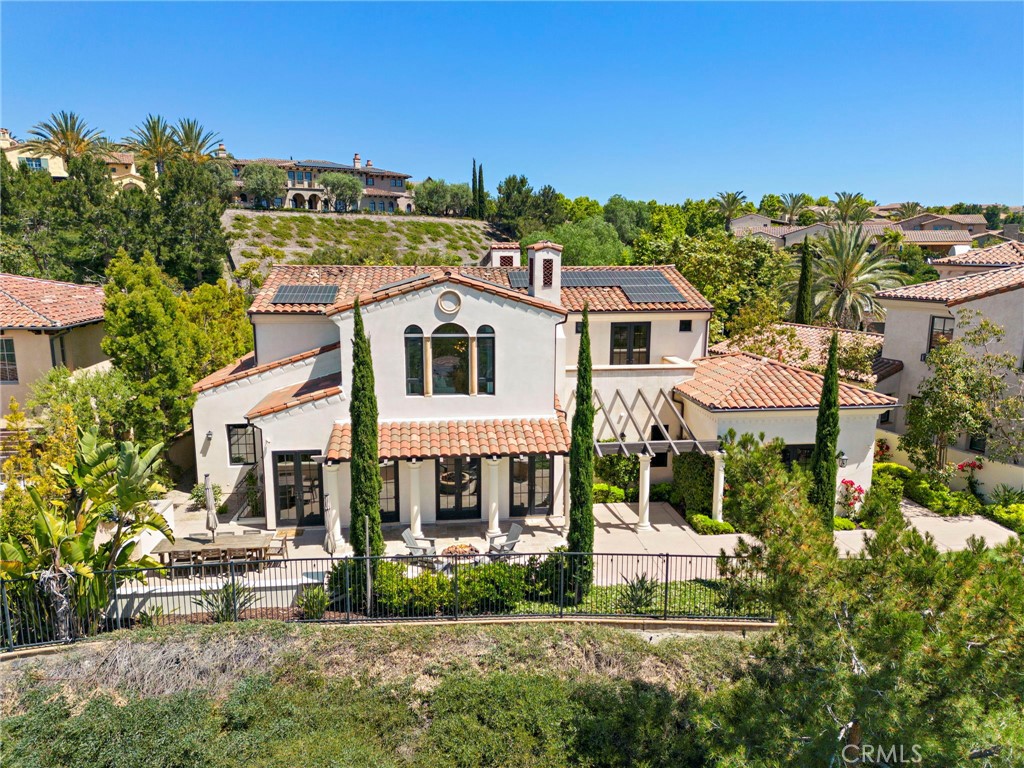19 Alexa Lane Ladera Ranch, CA 92694 - Photo 59 of 63 a view of a white house with a big yard and potted plants