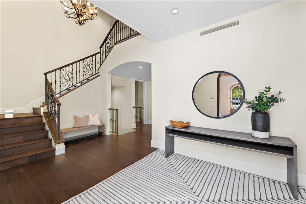 19 Alexa Lane Ladera Ranch, CA 92694 - Photo 7 of 63 a living room with wooden floor pool table and a potted plant