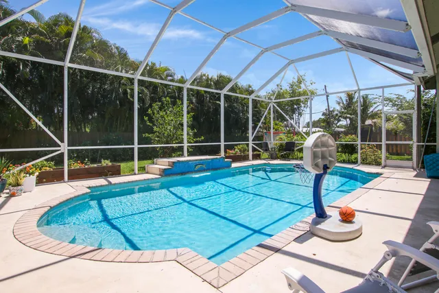 a view of a house with backyard porch and furniture