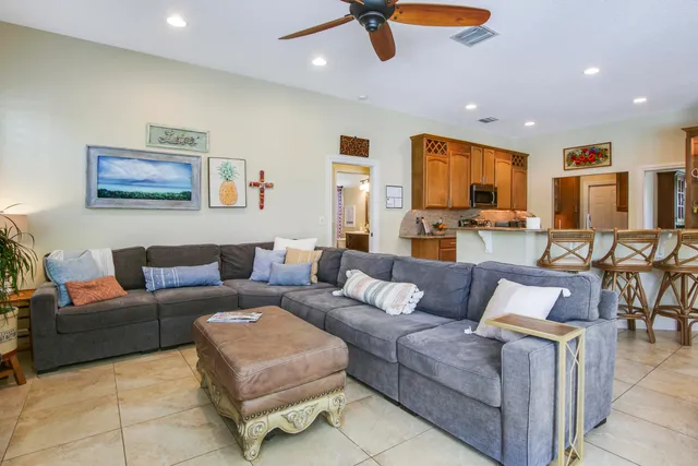 a kitchen with stainless steel appliances granite countertop a sink and a refrigerator