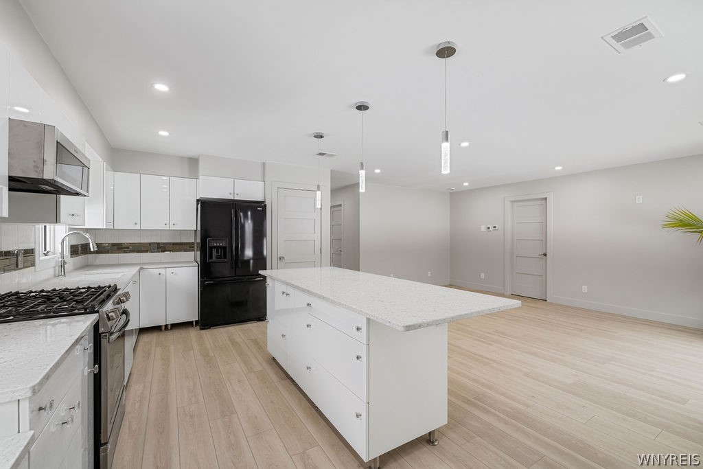 855 Madison Avenue Lewiston, NY 14092 - Photo 5 of 20 Open kitchen/living room combo with an abundance o