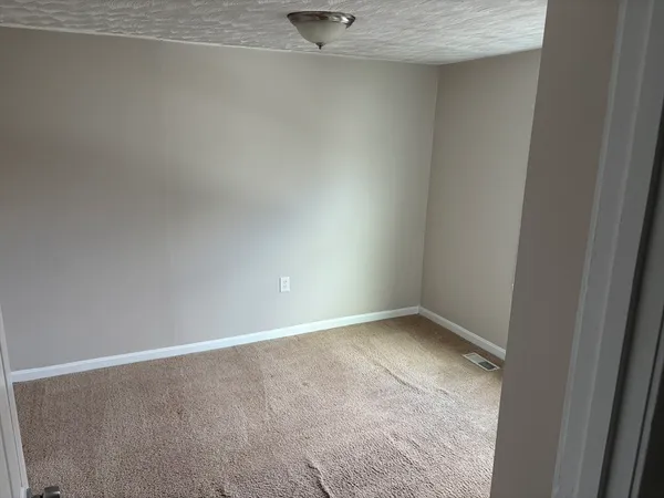 an empty room with a workbench