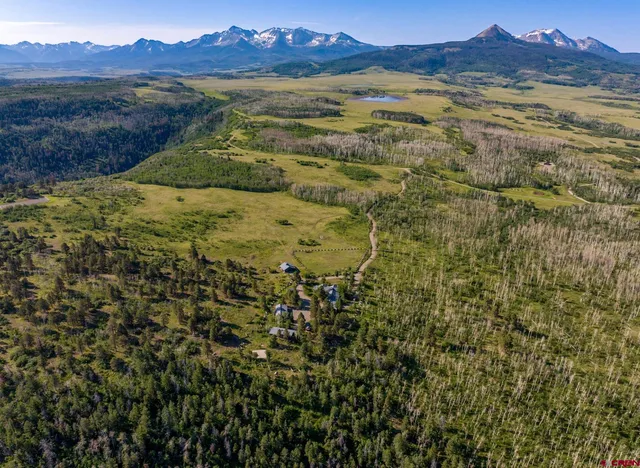 a view of an ocean with a mountain