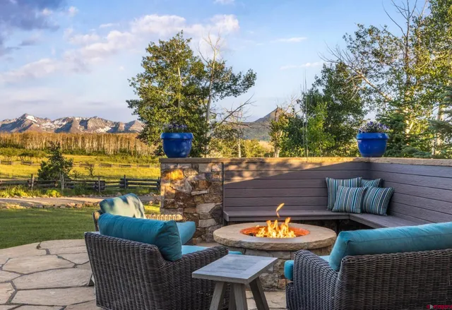 a outdoor living space with furniture and city view