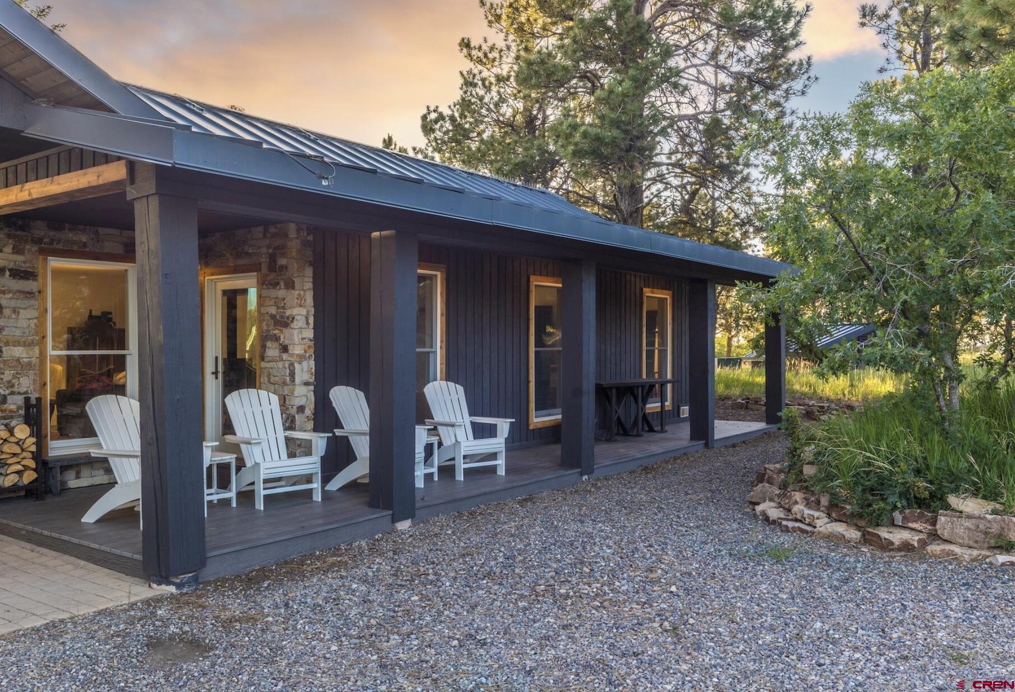 3289 Laughing Dog Road Placerville, CO 81430 - Photo 18 of 35 a view of a house with backyard porch and garden
