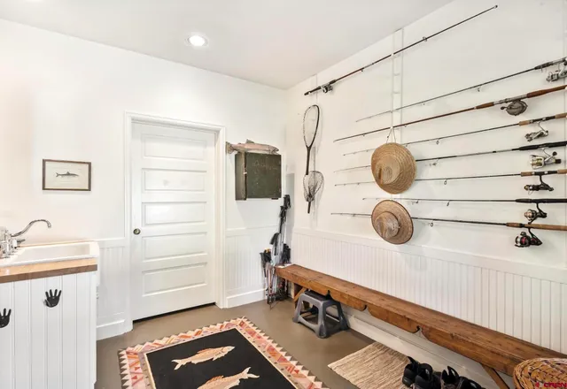 a view of a entryway with storage and utility room
