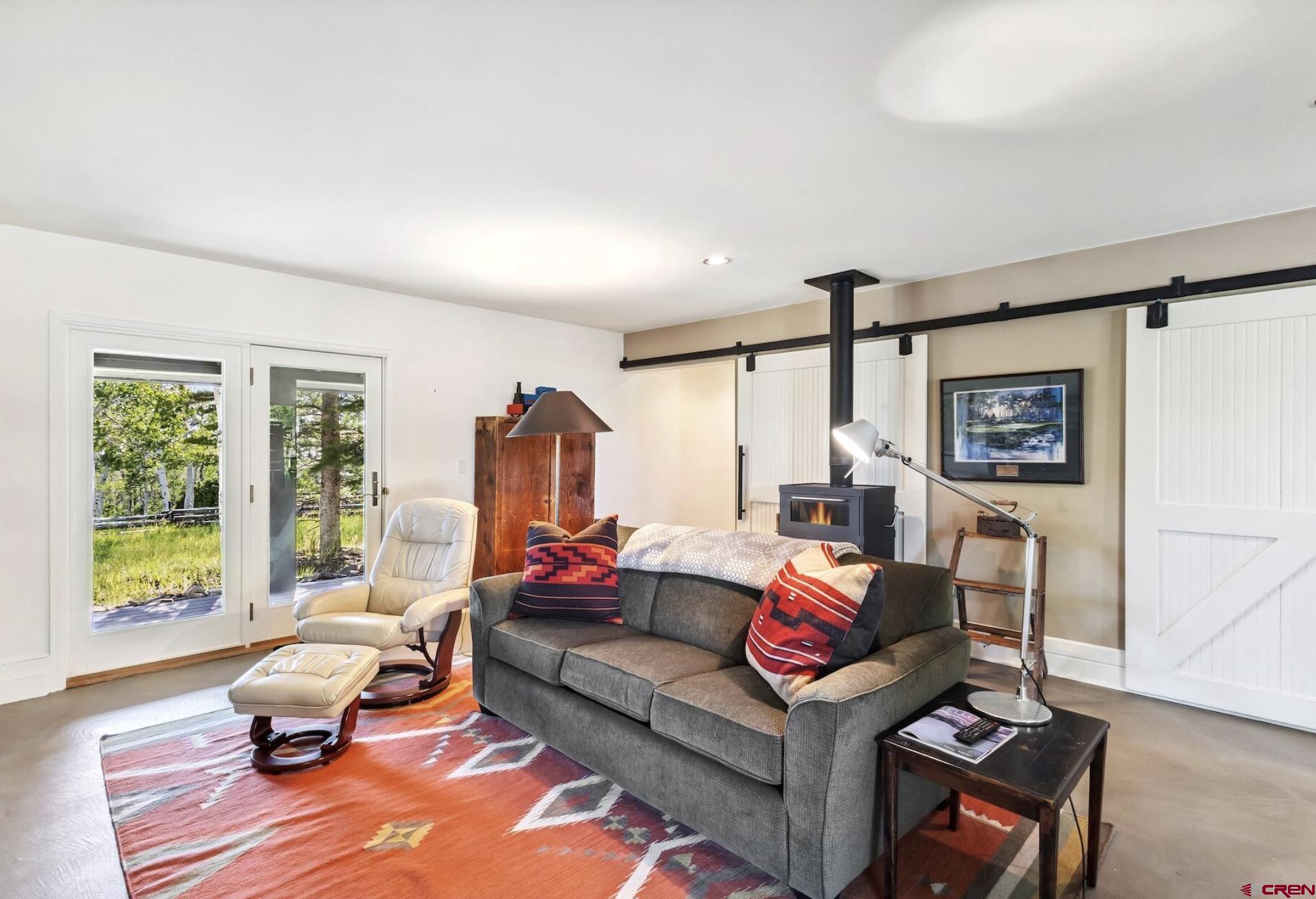 3289 Laughing Dog Road Placerville, CO 81430 - Photo 21 of 35 a living room with furniture and a window