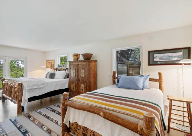 a bedroom with a bed and a table