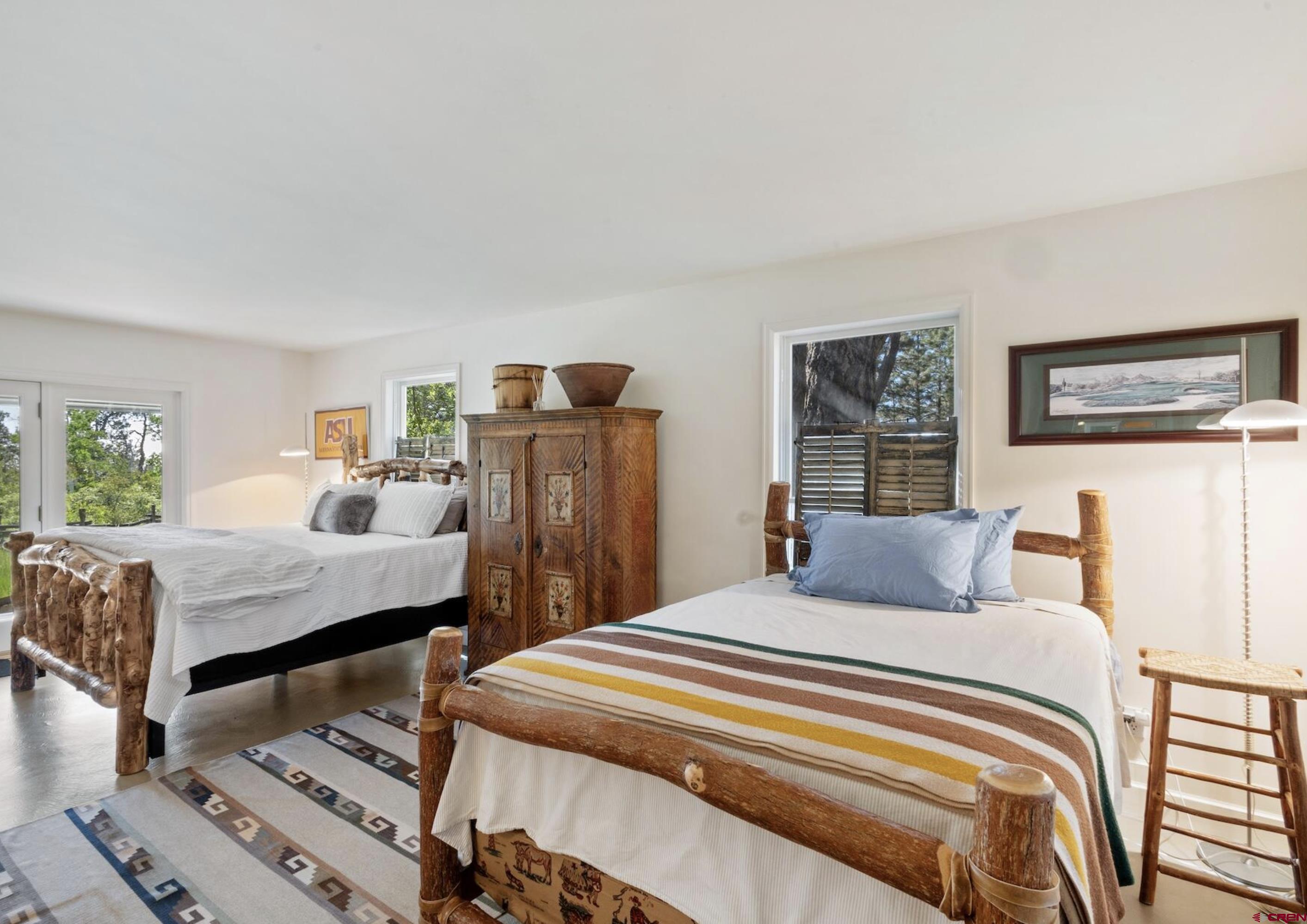 3289 Laughing Dog Road Placerville, CO 81430 - Photo 23 of 35 a bedroom with a bed and a table