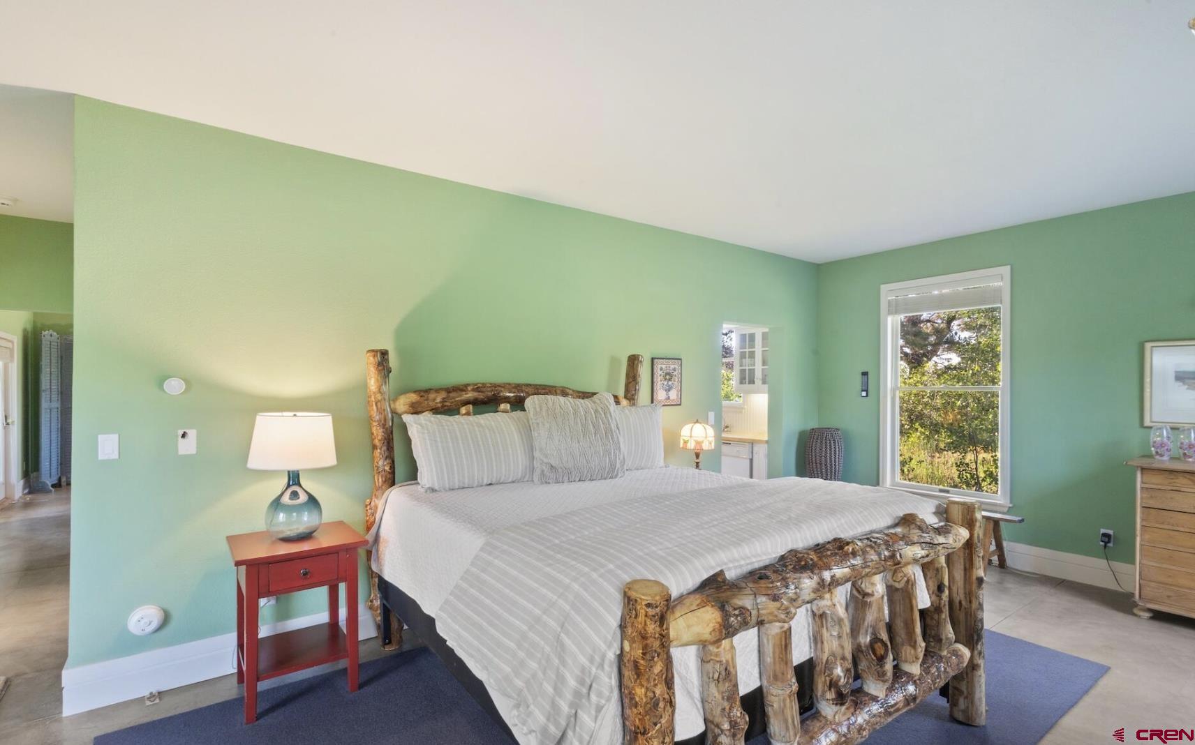 3289 Laughing Dog Road Placerville, CO 81430 - Photo 26 of 35 a bedroom with a bed and window