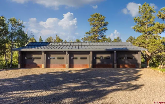 a view of a house with a flower garden