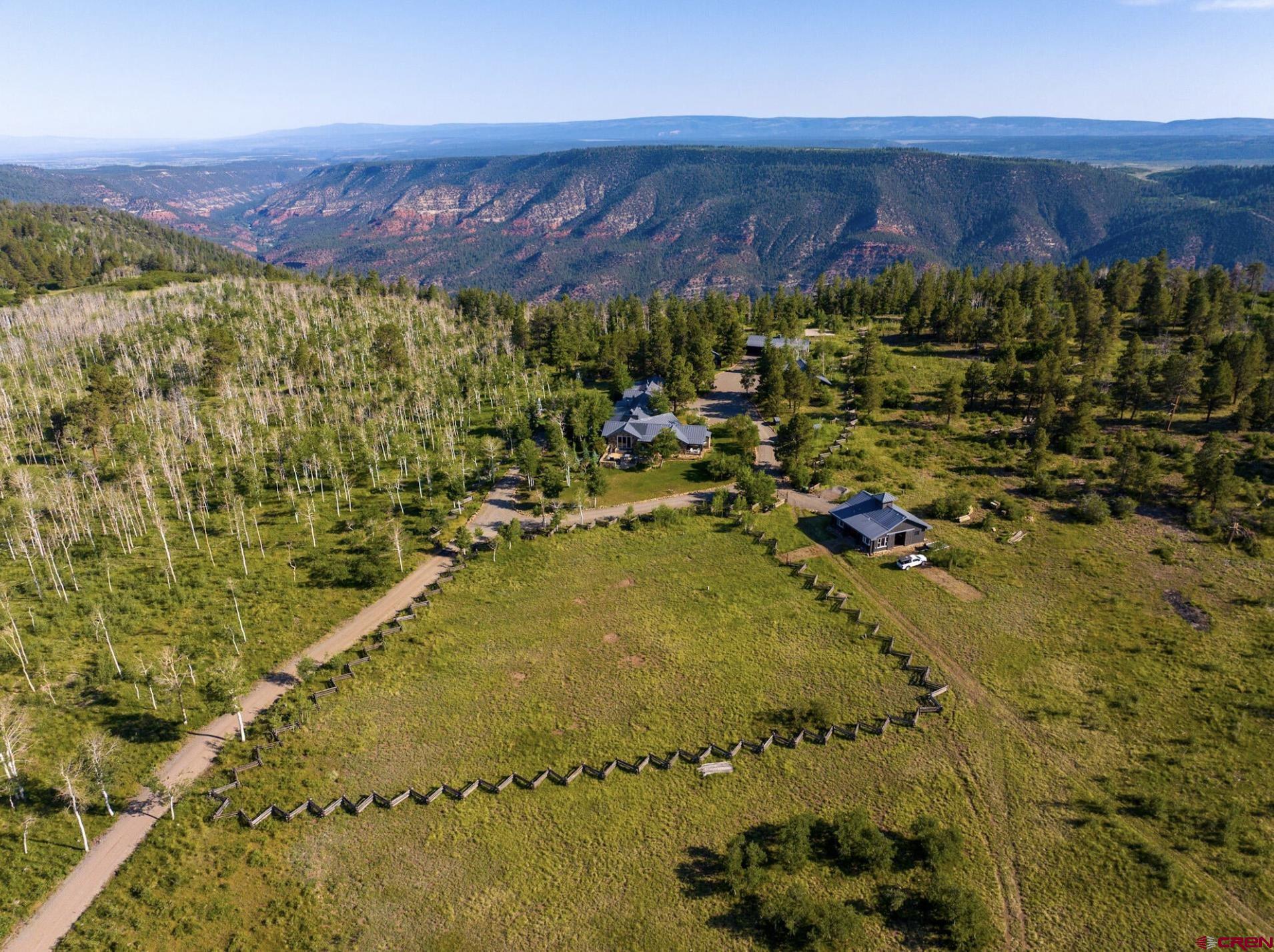 3289 Laughing Dog Road Placerville, CO 81430 - Photo 3 of 35 a view of swimming pool and mountain in the background
