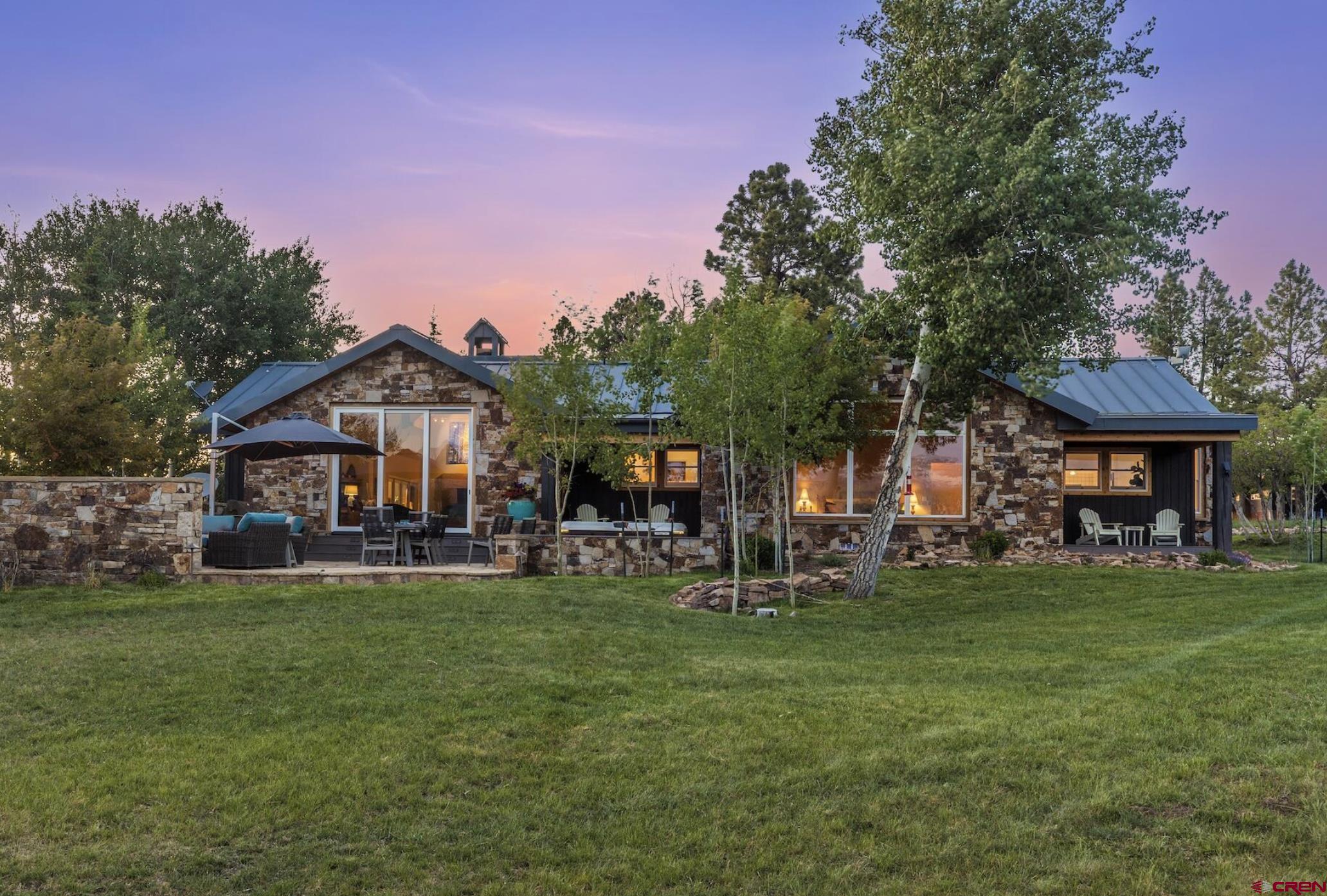 3289 Laughing Dog Road Placerville, CO 81430 - Photo 6 of 35 a front view of a house with garden