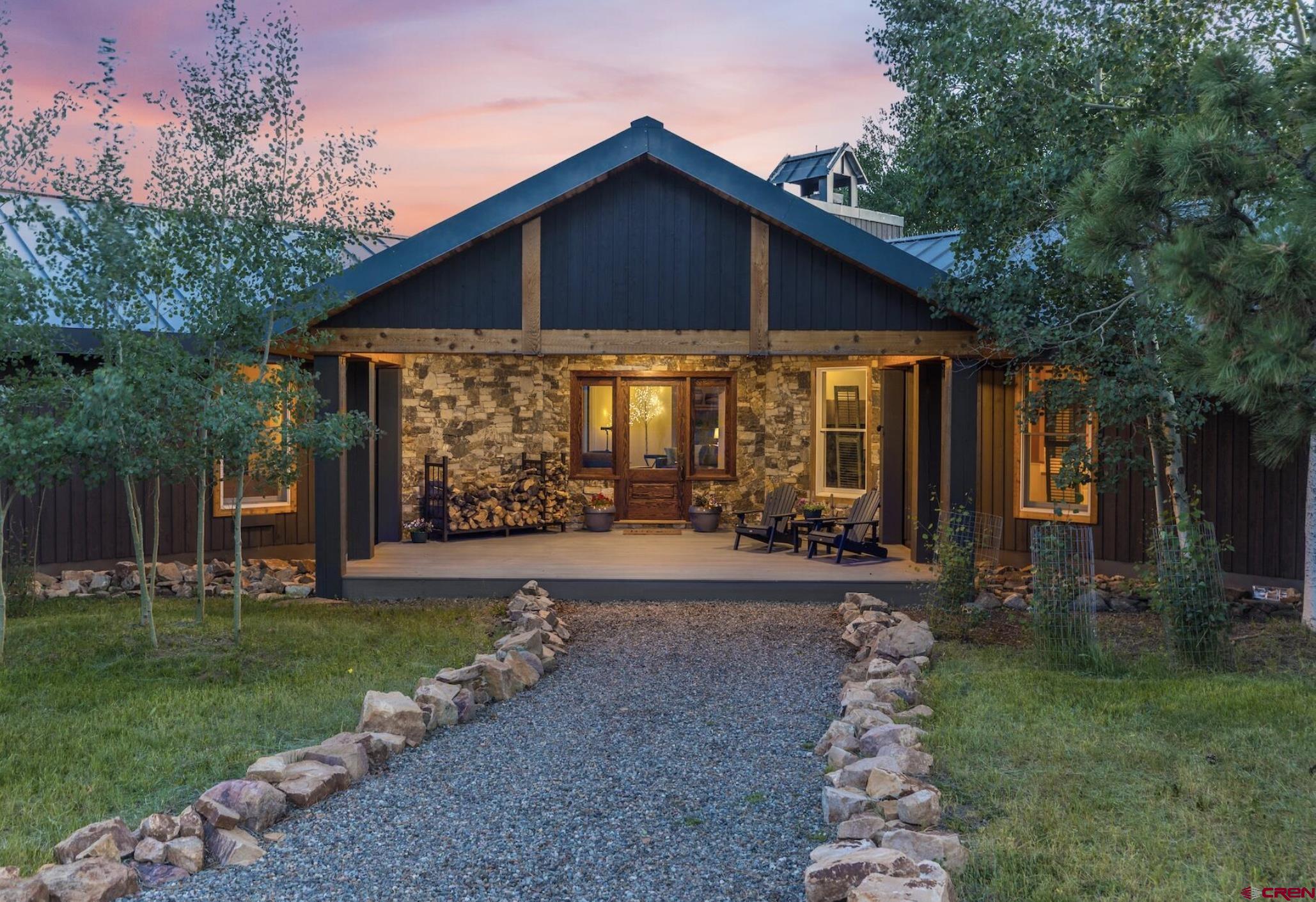 3289 Laughing Dog Road Placerville, CO 81430 - Photo 8 of 35 a front view of a house with garden