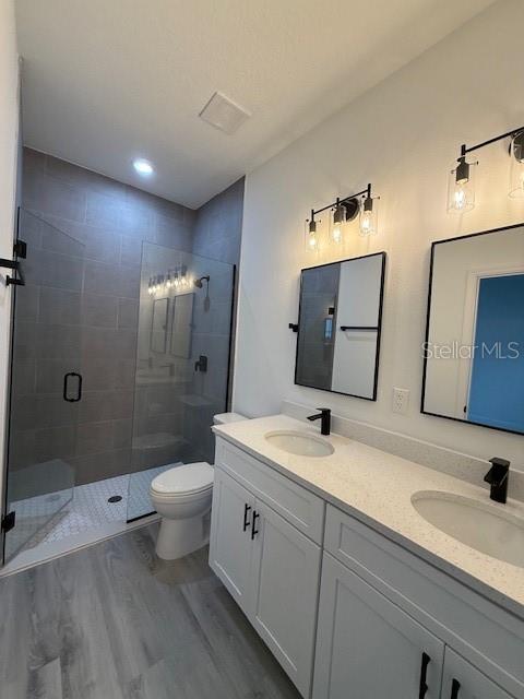 5669 North Claremont Drive Citrus Springs, FL 34434 - Photo 14 of 20 a bathroom with a double vanity sink toilet and shower