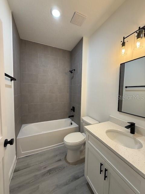 5669 North Claremont Drive Citrus Springs, FL 34434 - Photo 18 of 20 a bathroom with a granite countertop sink a toilet and a bathtub